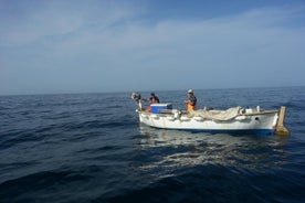 Fishing on Traditional Dubrovnik Fishing Boat in Front of Old City Walls