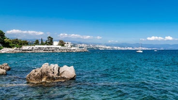 photo of aerial panoramic view of beautiful town of Lovran and sea walkway in Croatia.