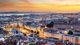 Photo of aerial view over People Crowd Having Fun On Beach And Over Cascais City In Portugal.