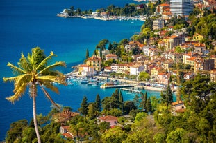 photo of aerial panoramic view of beautiful town of Lovran and sea walkway in Croatia.