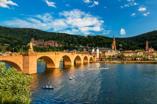 Photo of beautiful postcard view of the famous historic town of Rothenburg ob der Tauber on a sunny day with blue sky and clouds in summer, Franconia, Bavaria, Germany.