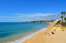 Photo of Carvoeiro fishing village with beautiful beach and colourful houses, Portugal.