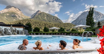 Photo of  beautiful Scuol town in Swiss Alps and Inn river, Switzerland.