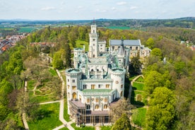 Photo of Lednice Chateau with beautiful gardens and parks on a sunny summer day, Czech Republic.