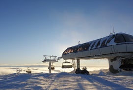 photo of beautiful vibrant aerial winter mountain view of ski resort Trysil, Norway. sunny winter day with slope, piste and ski lift.