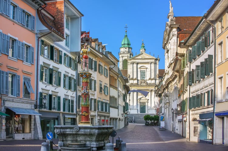 Photo of street with fountain and Cathedral in Solothurn, Switzerland.