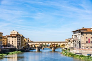 Photo of aerial view of Verona historical city centre, Ponte Pietra bridge across Adige river, Verona Cathedral, Duomo di Verona, red tiled roofs, Veneto Region, Italy.