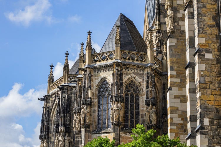 photo of view of Aachen Cathedral (Aachener Dom) - Roman Catholic church in Aachen, Germany. Aachen Cathedral is one of the oldest cathedrals in Europe (from 796), main Aachen's landmark and a cultural heritage.