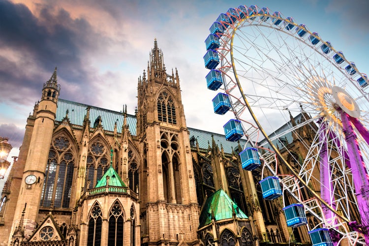 Photo of city of Metz, France, Cathedral Saint-Etienne with Christmas market and big wheel.