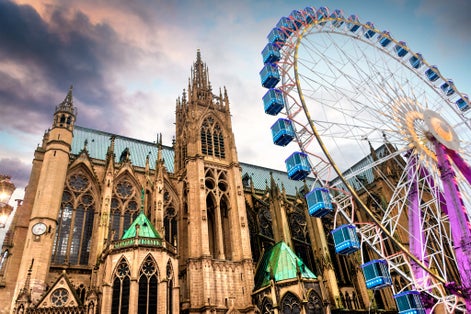 Photo of Cathedral Saint-Etienne with Christmas market and big wheel, city of Metz, France.