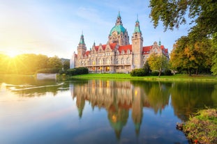 Photo of beautiful panoramic view of historic Bremen Market Square in the center of the Hanseatic City of Bremen with The Schuetting and famous Raths buildings on a sunny day with blue sky in summer, Germany.