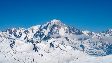 photo of French alps mountain and Saint-Gervais-les-Bains village, in spring in France.