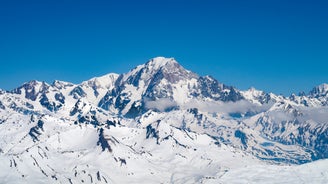 Photo of The winter view on the montains and ski lift station in French Alps near Chamonix Mont-Blanc.