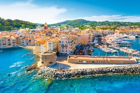 Photo of beautiful aerial view of Saint-Tropez, France with seascape and blue sky.