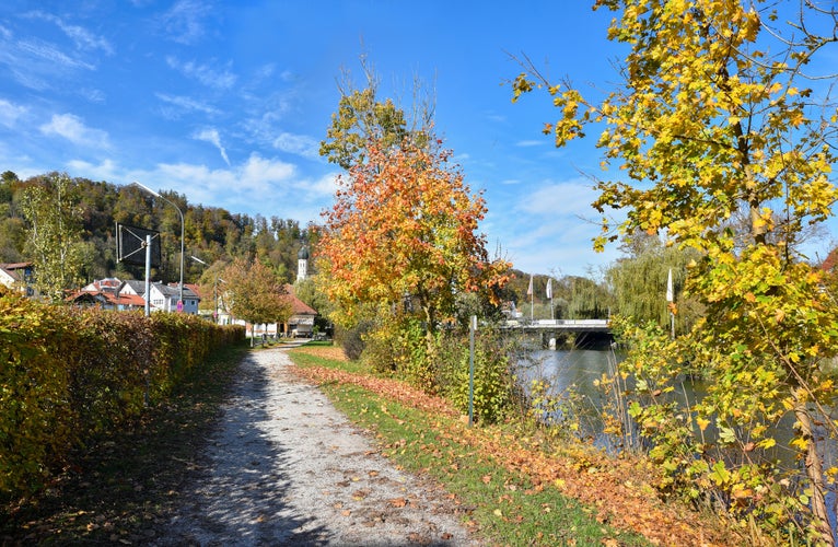 idyllic walkway beside Loisach river, autumnal landscape Wolfratshausen upper bavaria