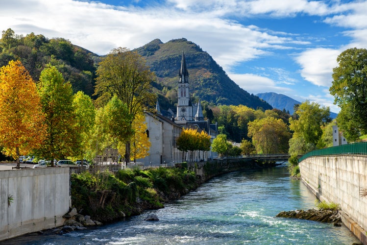 Photo of view of the basilica of Lourdes in autumn, France.