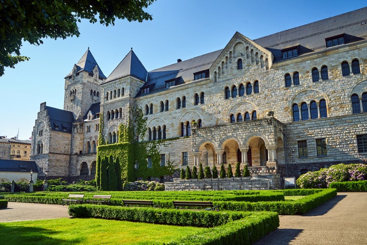 Photo of historic stone imperial castle with a garden in Poznan, Poland.