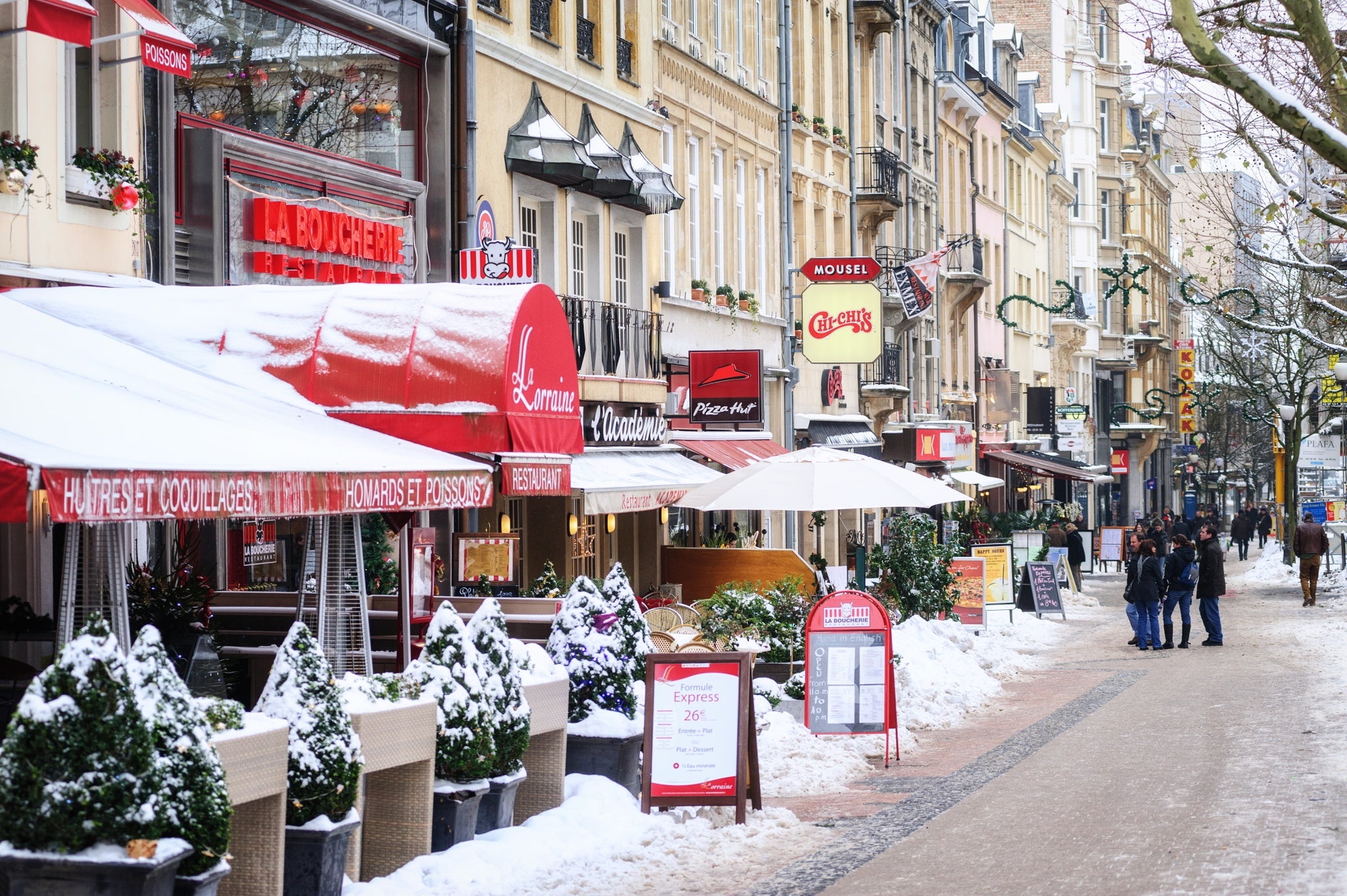 Snow covered pedestrian street in Luxembourg city on a cold winter day..jpg