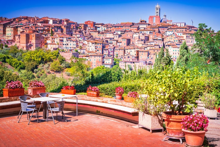 photo of view of Siena, Italy. Charming medieval city in Tuscany known for its stunning cathedral, Torre del Mangia, beautiful piazzas, and the famous Palio horse race.