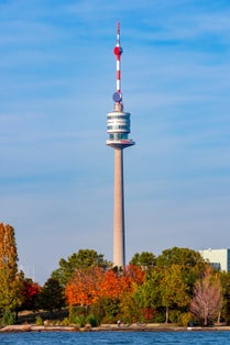 photo of view of Danube tower (Donauturm) in autumn, Vienna, Austria.