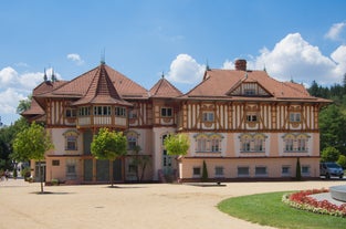 Photo of Lednice Chateau with beautiful gardens and parks on a sunny summer day, Czech Republic.