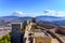 photo of medieval Castillo de Santa Catalina on top of a mountain with the city of Jaen below in Spain.