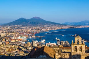 photo of aerial panorama of high cliffs, Tyrrhenian Sea Bay with pure azure water, floating boats and ships, pebble beaches, rocky surroundings of Meta in Sant'Agnello and Sorrento cities near Naples region in Italy.