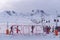 photo of panoramic view of Erciyes Ski Resort with people skiing on the ski slope in Kayseri, Turkey.