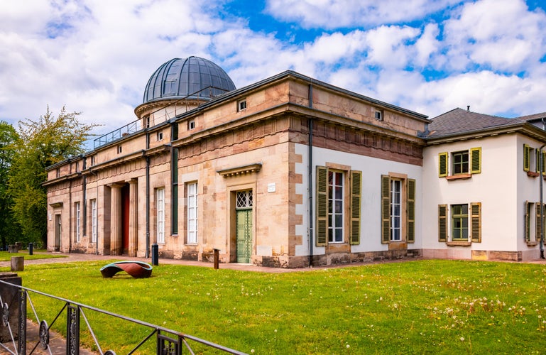 Photo of panoramic view of historic observatory with cupola dome for telescopes, a sight and monument in university town Goettingen, Germany.