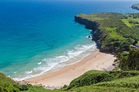 Photo of Ballota beach with the islet Castro, Llanes,  Spain.