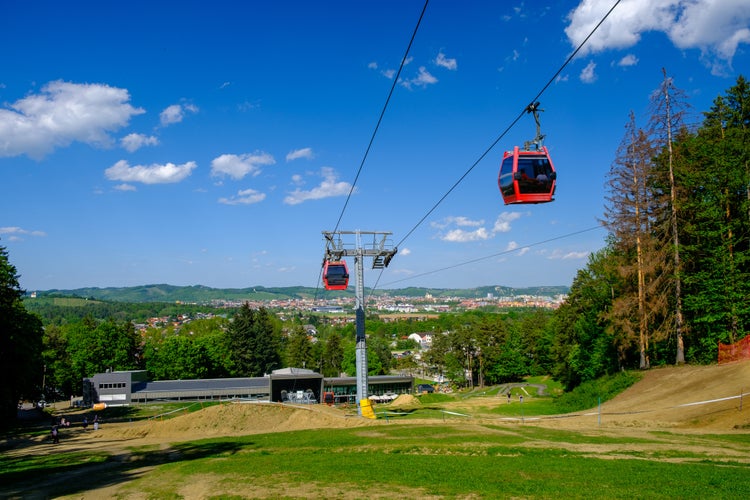 Overhead cable cars at lower station of cableway on Pohorje in Maribor, Slovenia, Mariborsko Pohorje ski slopes are popular hiking destination in summer