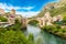 Photo of Stari Most is a reconstruction of a 16th-century Ottoman bridge in the city of Mostar in Bosnia and Herzegovina that crosses the river Neretva and connects two parts of the city.