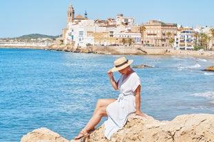 Photo of Sand beach and historical Old Town in mediterranean resort Sitges near Barcelona, Costa Dorada, Catalonia, Spain.