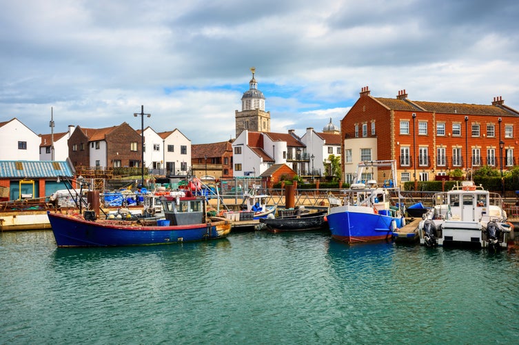 Fishing boats in the boat harbour in Portsmouth Old town center, England, United Kingdom