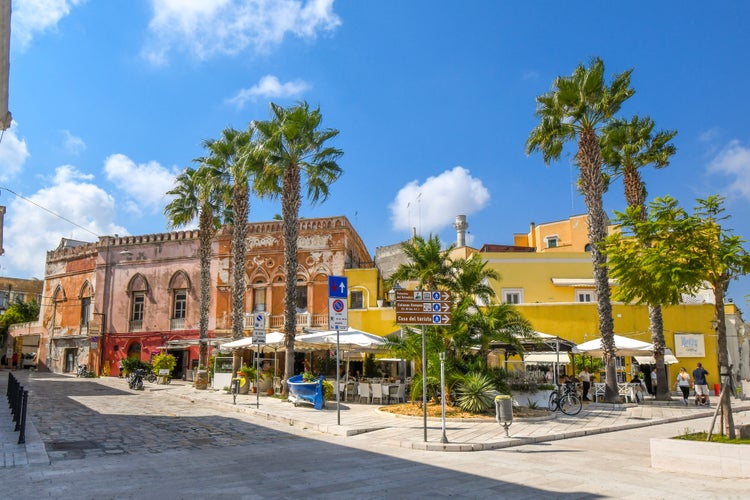 A sidewalk cafe with covered patio at the seaside promenade and boardwalk in the city of Brindisi, Italy, in the Puglia region.