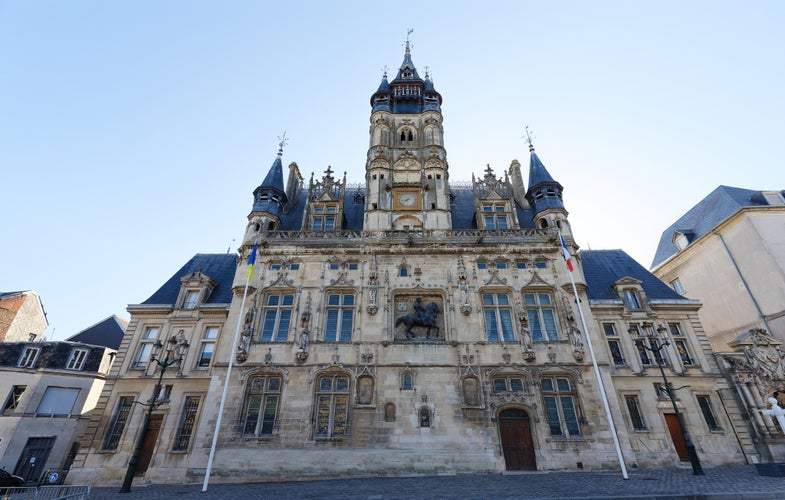 Photo of the town Hall of Compiegne has an elegant architecture typical of the flamboyant gothic style of the 16th century, France.