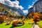 Photo of beautiful autumn view of Lauterbrunnen valley with gorgeous Staubbach waterfall and Swiss Alps at sunset time, Switzerland.