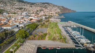 Aerial drone view of Camara de Lobos village, Madeira.