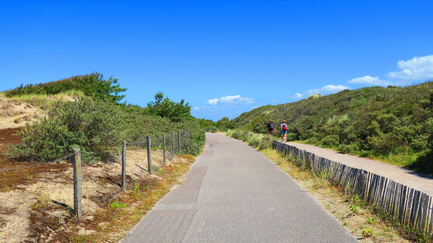 walkers in dunes of the Touquet , Pas de Calais , Hauts de France , France