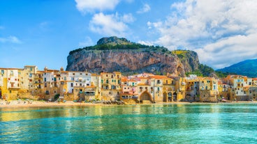 Photo of view of Cefalu and Promontorio de Torre Caldura seen from Norman Castle, La Rocca park, Italy.