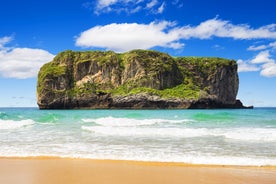 Photo of Ballota beach with the islet Castro, Llanes,  Spain.