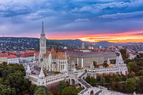 Photo of aerial panoramic skyline view of Budapest at cloudy sunset with Matthias Church(Mátyás Templom) and Fisherman's bastion (Halászbástya), Budapest, Hungary.