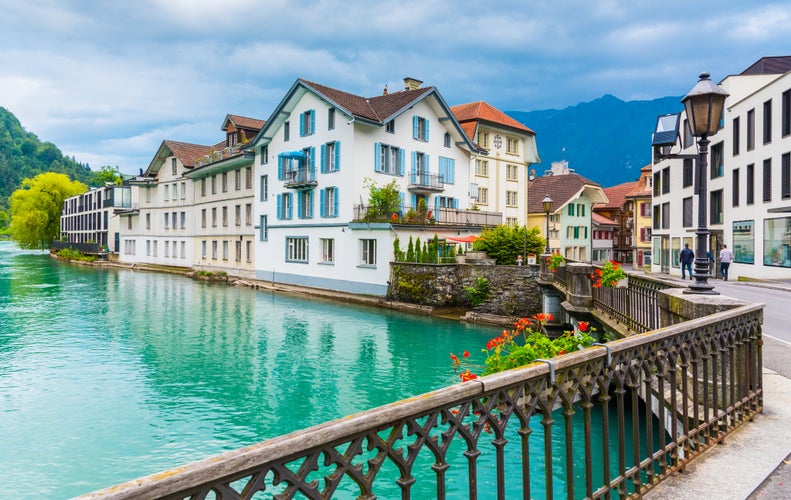 Photo of Interlaken town with Thunersee river, Switzerland .