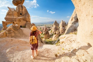 Hot air balloons flying over Uchisar Castle. Cappadocia. Nevsehir Province. Turkey.