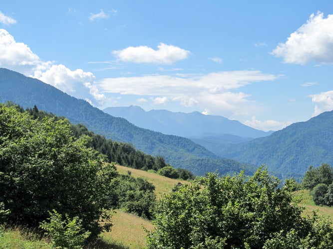 photo of view of A beautiful view of the Bucegi Mountains from Sacele, Romania.