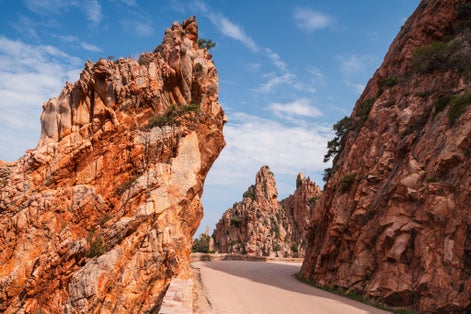 Photo of mountain road in Calanques de Piana. Corsican red rocks located in Piana, between Ajaccio and Calvi.
