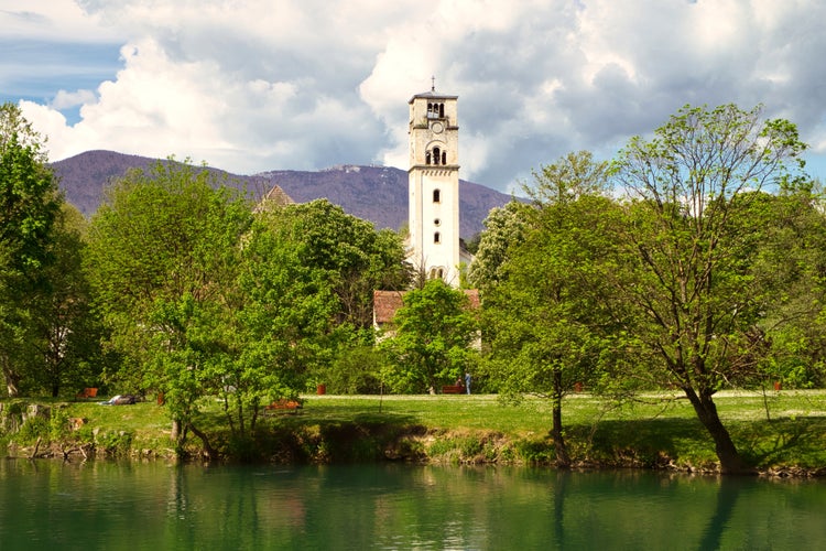 photo of The old clock tower Sahat Kula and mountain river Una in Bihac, Bosnia and Herzegovina.