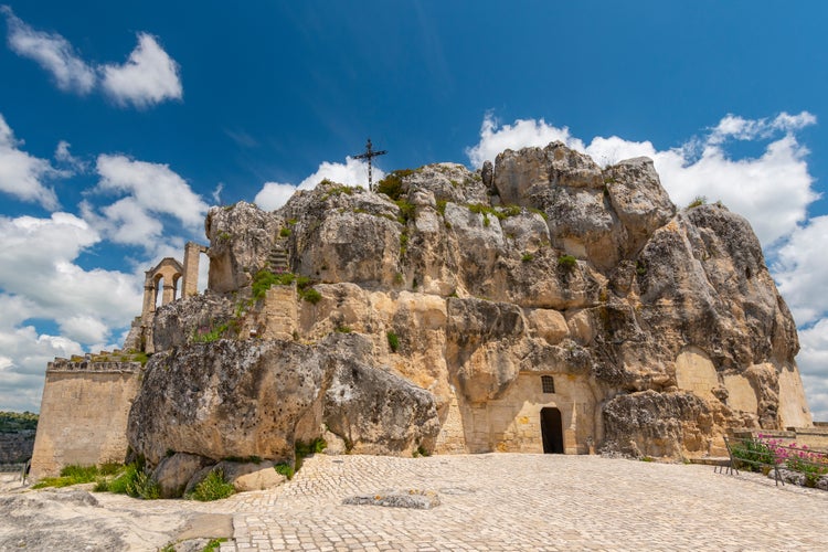 Photo of the church of Madonna de Idris ( Chiesa Rupestre di Santa Maria di Idris ) in the rock. Cave church in Sassi old town, Matera, Italy.