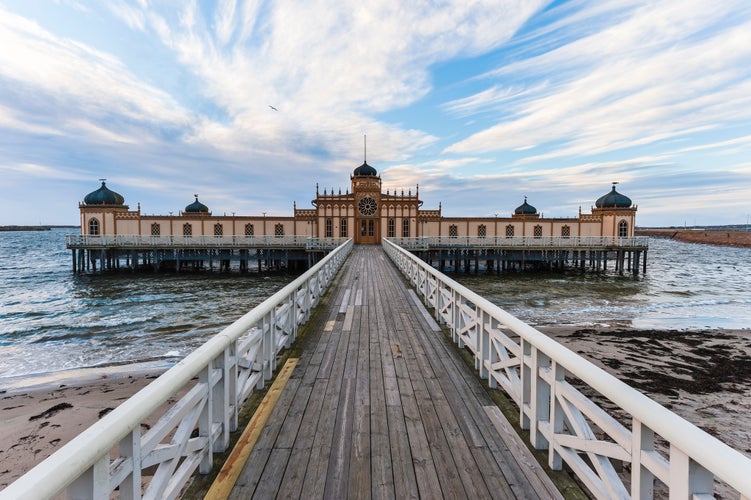 photo of Cold bath house, kallbadhuset, on poles on a beautiful morning by the beach in Varberg Sweden.