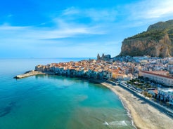 Photo of view of Cefalu and Promontorio de Torre Caldura seen from Norman Castle, La Rocca park, Italy.